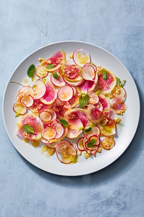 slices of bright radish salad on a white plate