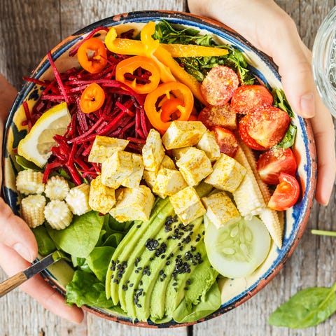 Bright vegetable buddha bowl with tofu.