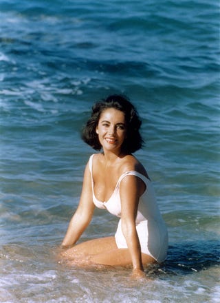 on the set of suddenly, last summer wearing a white bathing suit