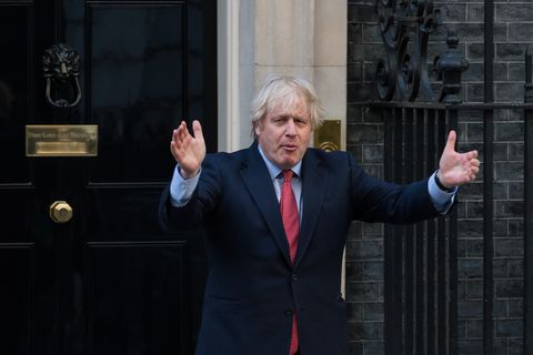 boris johnson applauds nhs and key workers from downing street in london