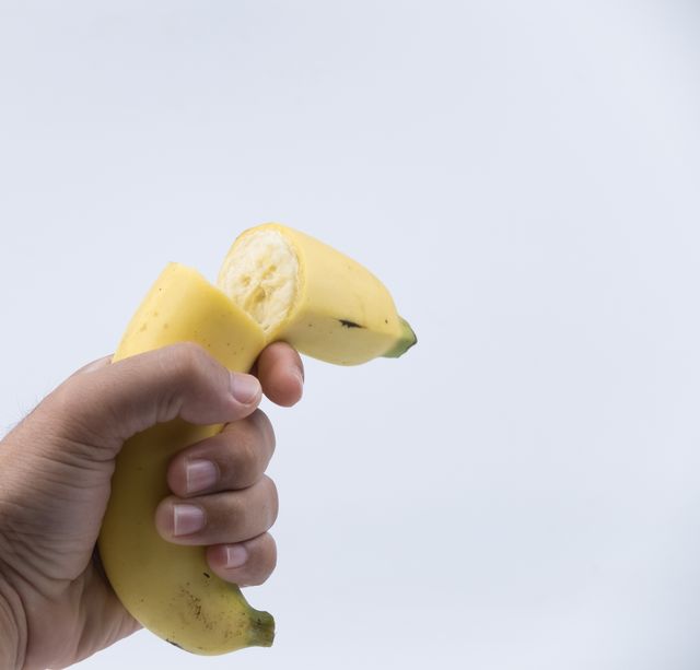 broken banana in hand