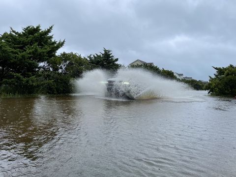 a 2021 bronco splashing through a puddle