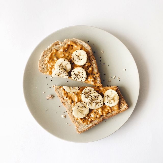 peanut butter chia seed banana toast for breakfast on a white background, healthy snack, top view