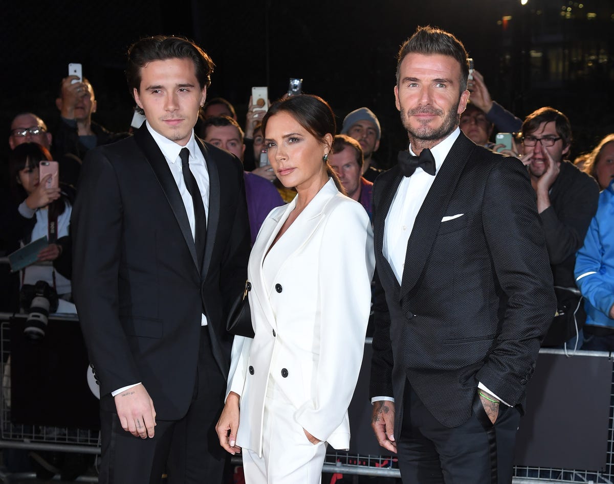 David, Victoria And Brooklyn Beckham Wear Suits For GQ Awards