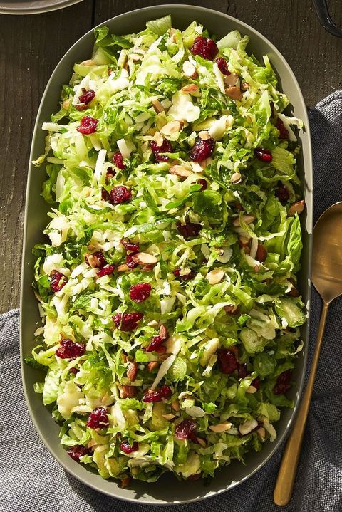 a platter of brussels sprout salad with dried cranberries