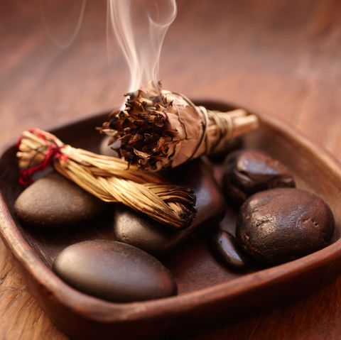 Burning incense Sage stick and pebbles