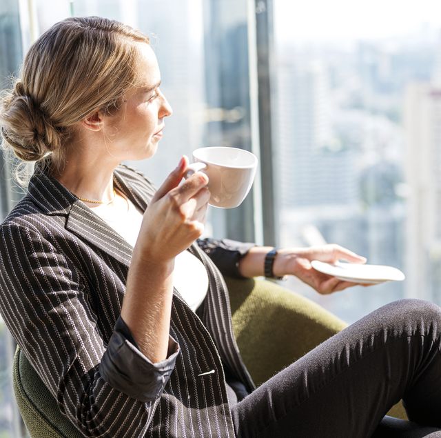 business people, relax and leisure concept happy smart business woman with cup of tea or coffee at modern office