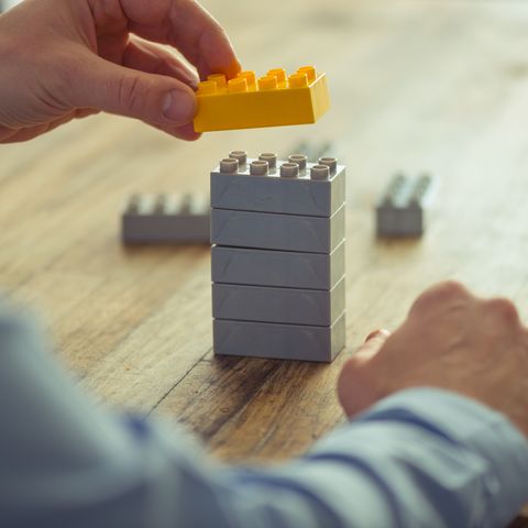 Businessman using lego blocks