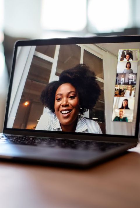 businesswoman having a video call meeting with her team