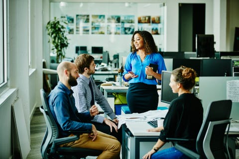 Businesswoman leading meeting with colleagues businesswoman leading meeting with colleagues