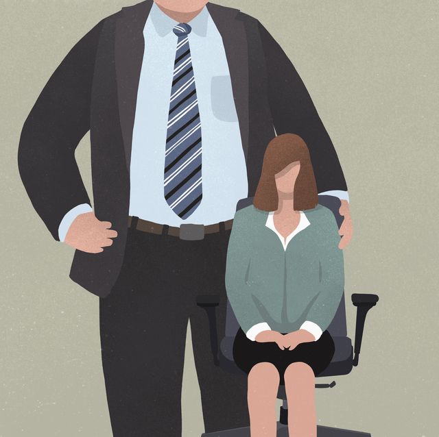 Businesswoman sitting in office chair next to giant man in suit