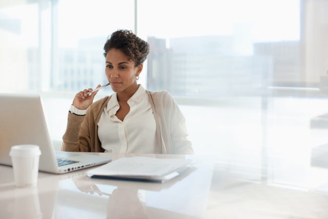 businesswoman using laptop in office