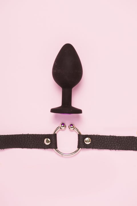 adult sex toys and accessories on pink background