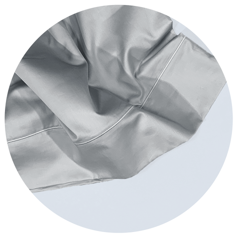 silver pimacott sheets in a white circular graphic frame