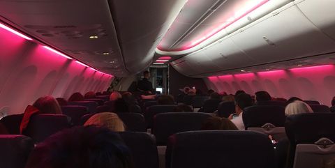 Aircraft cabin, Transport, Air travel, Red, Comfort, Passenger, Pink, Ceiling, Airline, Magenta, 