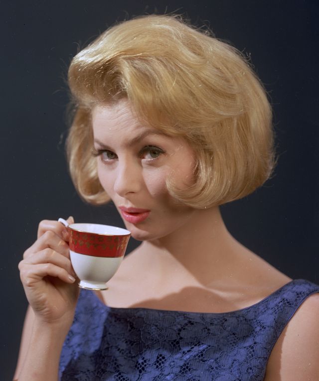 circa 1961 a well groomed young woman quenching her thirst with a cup of strong coffee photo by chaloner woodsgetty images