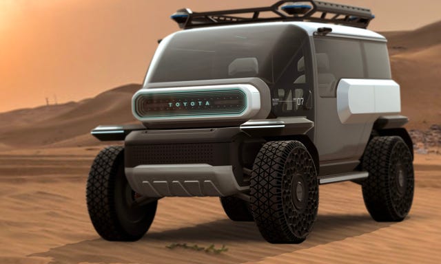 a toyota suv concept driving on a sandy road