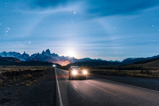 car driving at night on the road to el chalten, patagonia argentina