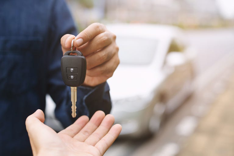 car-key-businessman-handing-over-gives-the-car-key-royalty-free-image-1589031658.jpg?resize=768:*