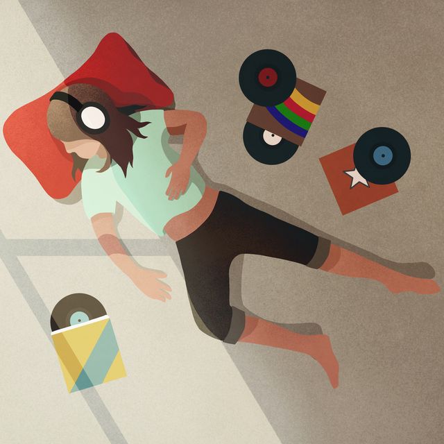 carefree girl with headphones listening to records