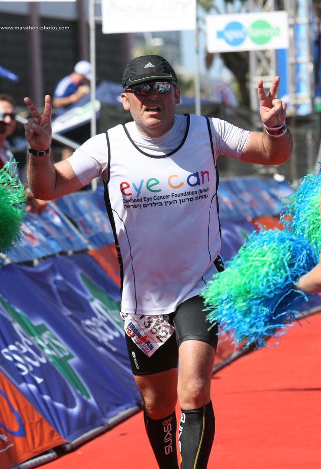 carl linde at the finish line of a half ironman in south africa