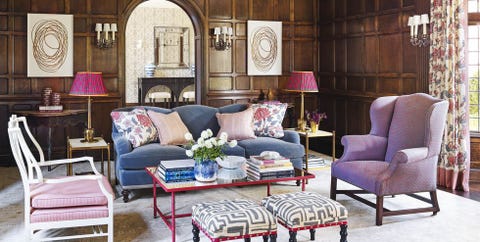 the living room's wall lights and most of the oak paneling are original to the home