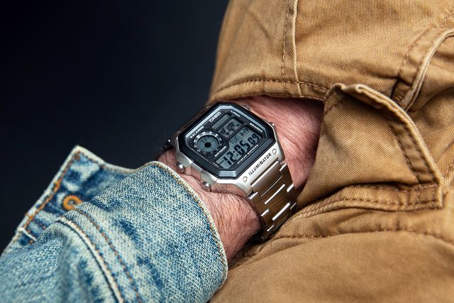 hand in a pocket wearing the casio world time watch on wrist