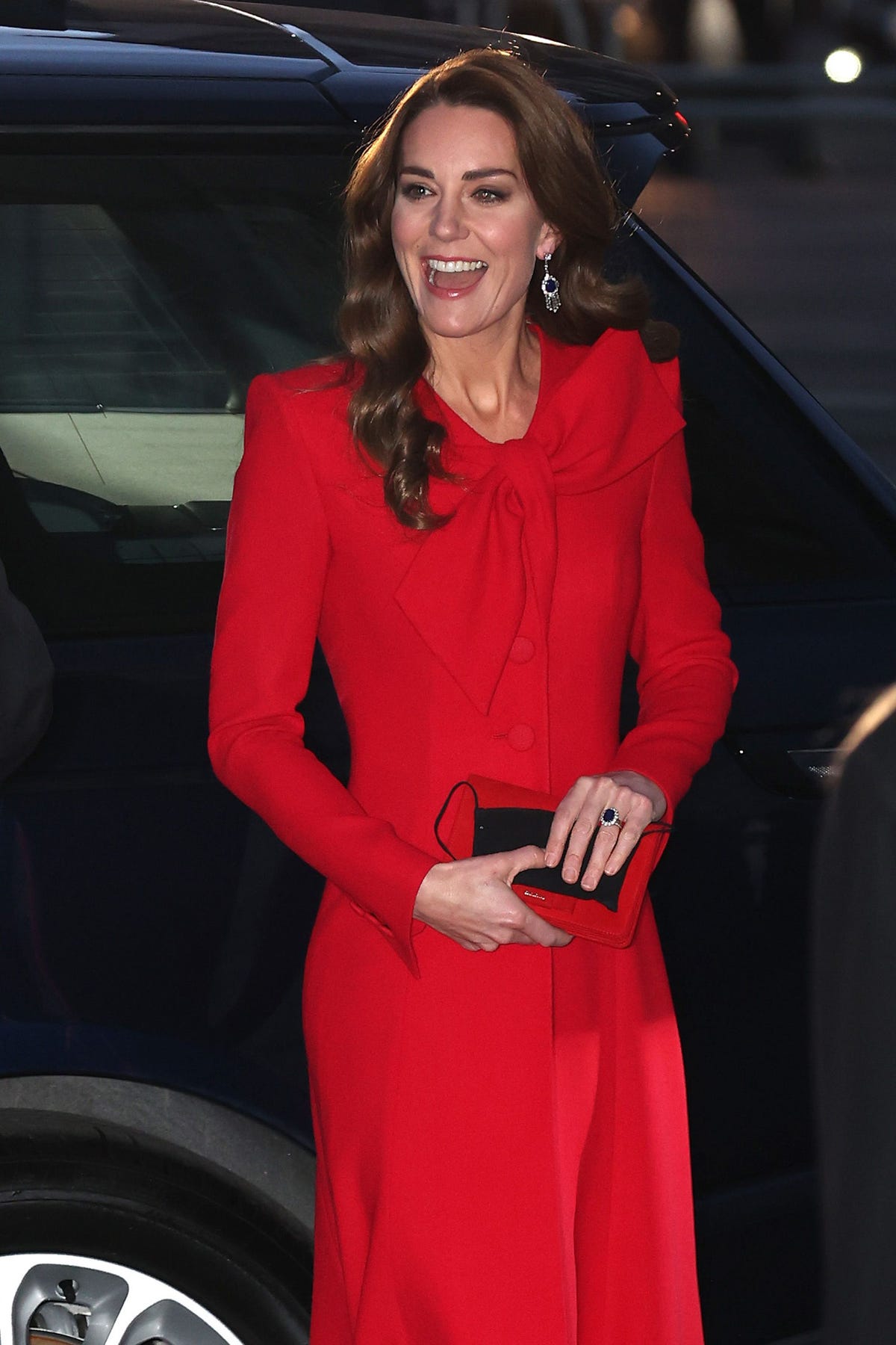 The Duchess of Cambridge looks festive in red at Christmas carol concert