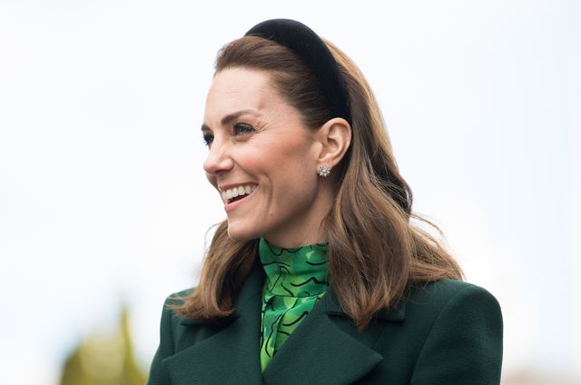 kate in a green dress and a black headband visiting ireland in march 2020