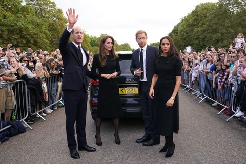The Prince and Princess of Wales, accompanied by the Duke and Duchess of Sussex, greet well-wishers outside Windsor Castle