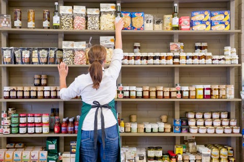 Caucasian clerk working in grocery store Caucasian clerk working in grocery store
