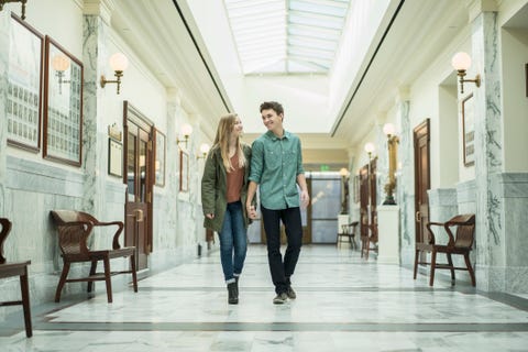 Caucasian couple walking in courthouse Caucasian couple walking in courthouse