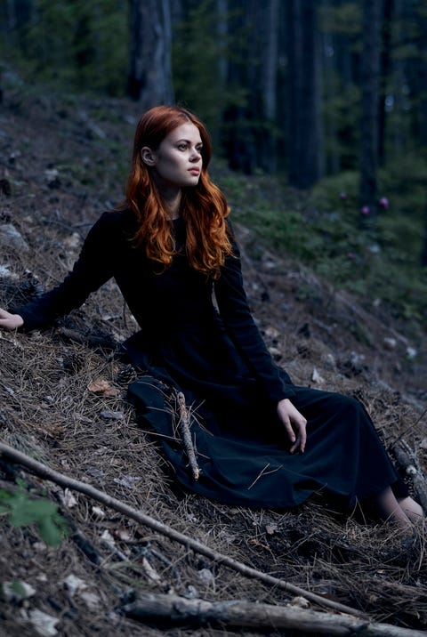 Caucasian woman sitting on hill caucasian woman sitting on hill