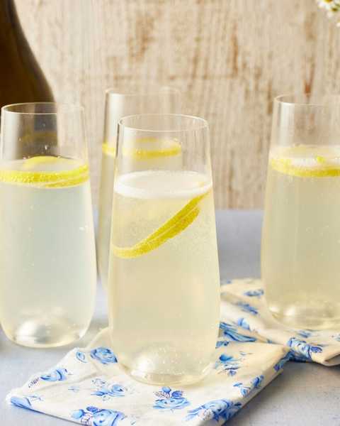 french 75 cocktail with lemon twist and blue and white napkin