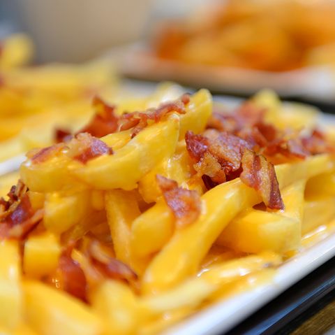 French fries and cheese with bacon on top