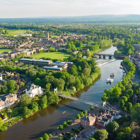 aerial view of river dee in chester at dusk including queens park bridge and the old dee bridge, cheshire, england, uk