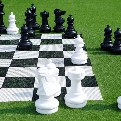 chess pieces and board on lawn