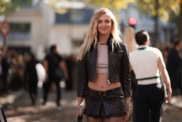 paris, france october 04 chiara ferragni seen wearing a short brown leather jacket, cropped beige miu miu top and short matching leather brown skirt, wild leather brown boots and a brown handbag outside miu miu during paris fashion week on october 4, 2022 in paris, france photo by jeremy moellergetty images