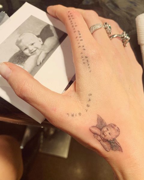 Temporary tattoo, Wrist, Arm, Tattoo, Skin, Hand, Religious item, Joint, Design, Finger, 