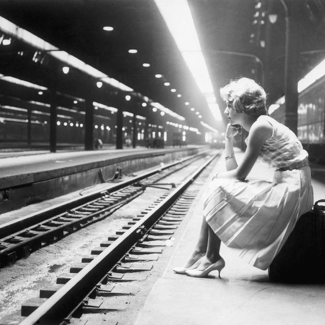 teenage girl waiting for train