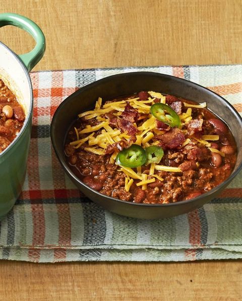 beef and bean chili with shredded cheese and jalapeno