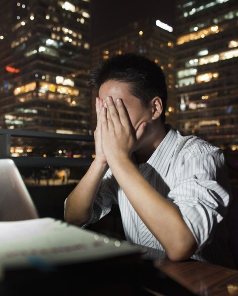 chinese businessman working at desk at night