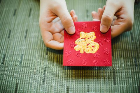chinese new year celebration give or receiving red envelop