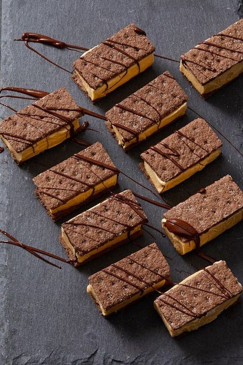 rectangular chocolate and pumpkin ice cream bar sandwiches with chocolate drizzled on top