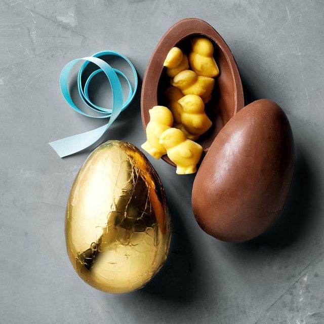 chocolate easter eggs filled with chicks gold foil and ribbon