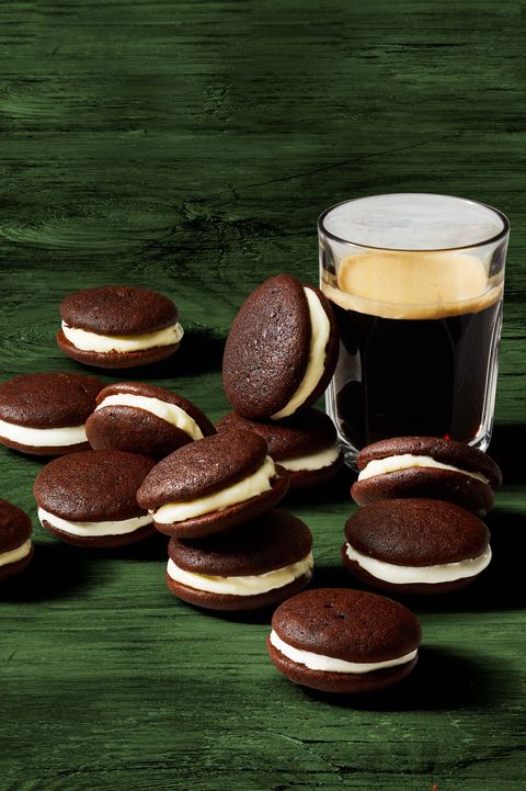 chocolate whoopie pies next to a glass of dark beer