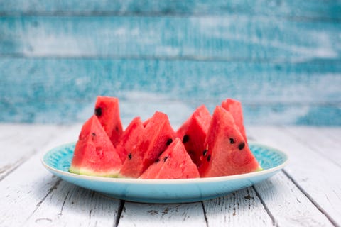 Chopped watermelon on blue plate Chopped watermelon on blue plate