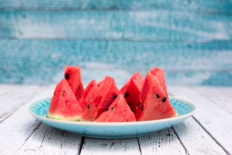 Chopped watermelon on blue plate