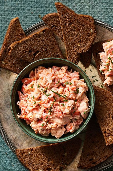 salmon rillette in a bowl with toasted rye bread