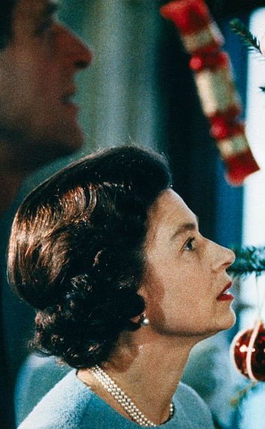 Queen Elizabeth and Prince Philip Looking at Christmas Tree